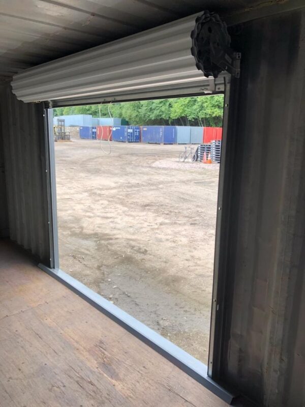 8′ Wide x 7′ 4″ Tall Roll Door In High Cube Container Side - Image 2